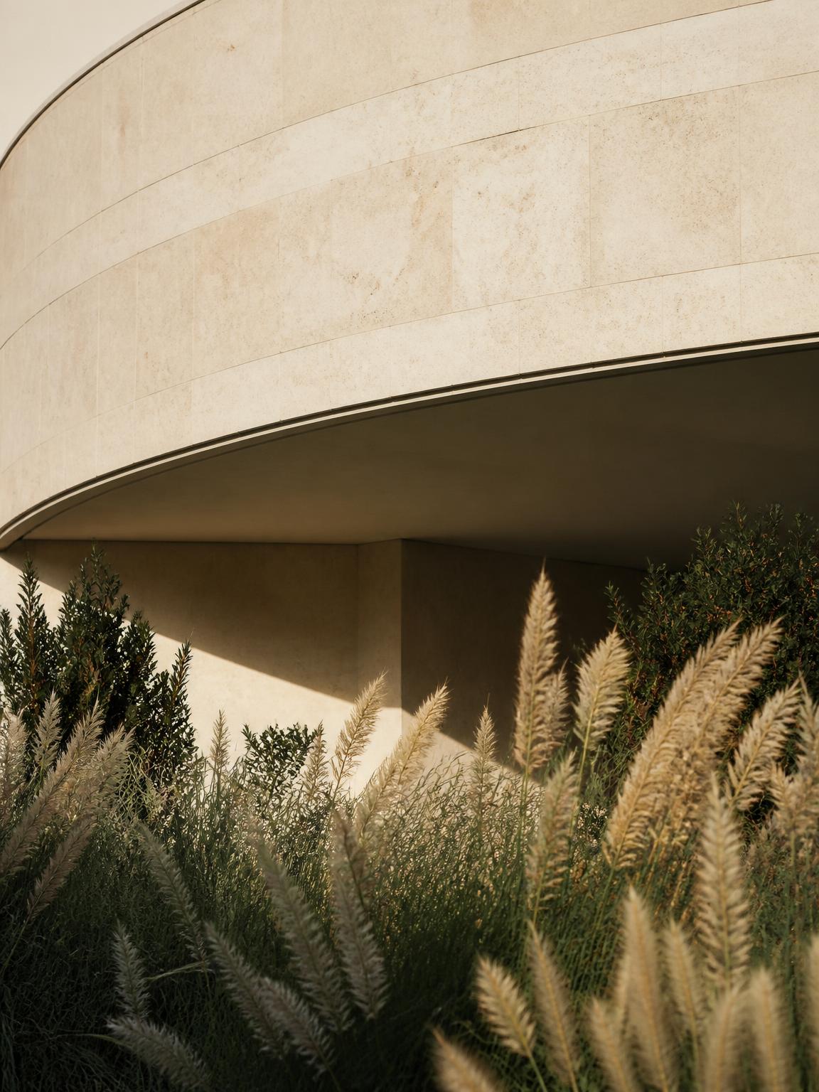 A curved architectural wall in warm light.